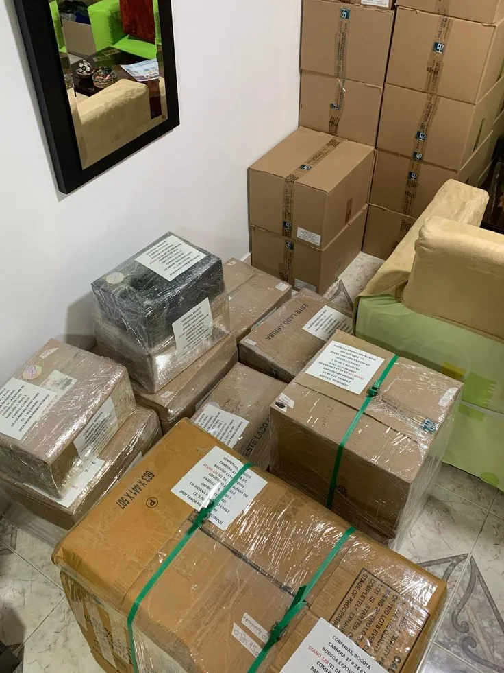 Professional export packing department preparing custom apparel for international shipment at a garment manufacturing facility in Pakistan.