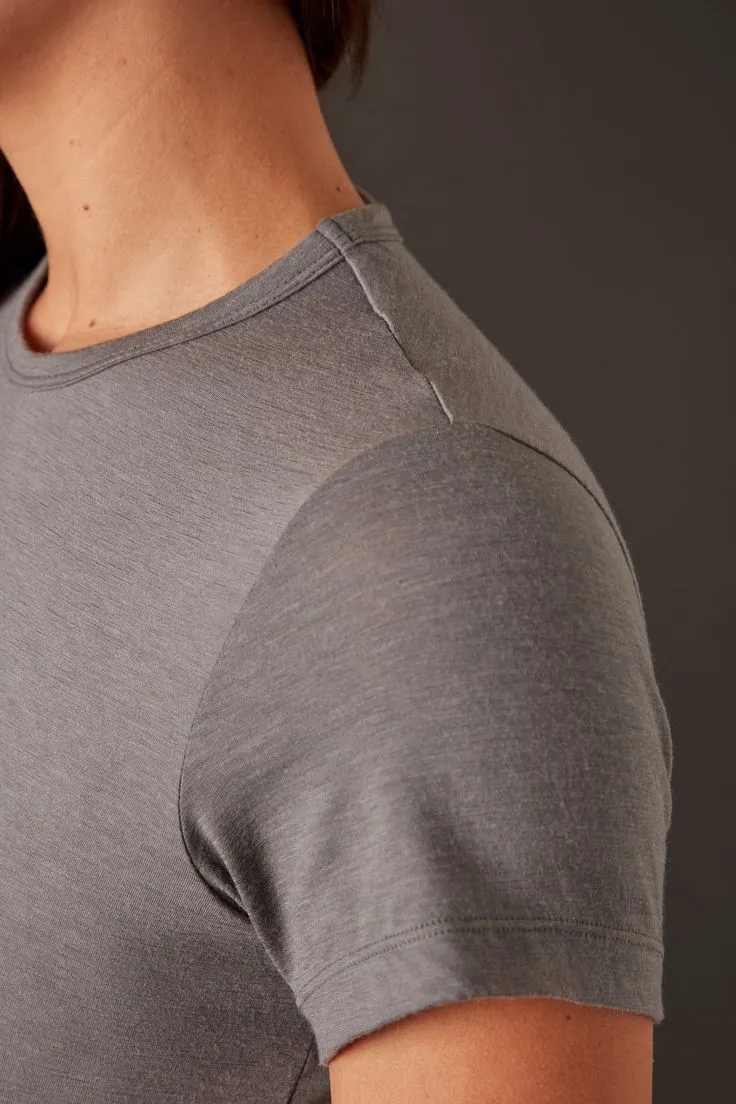 Close-up of custom T-shirt neckline, shoulder seam, stitching and hem construction