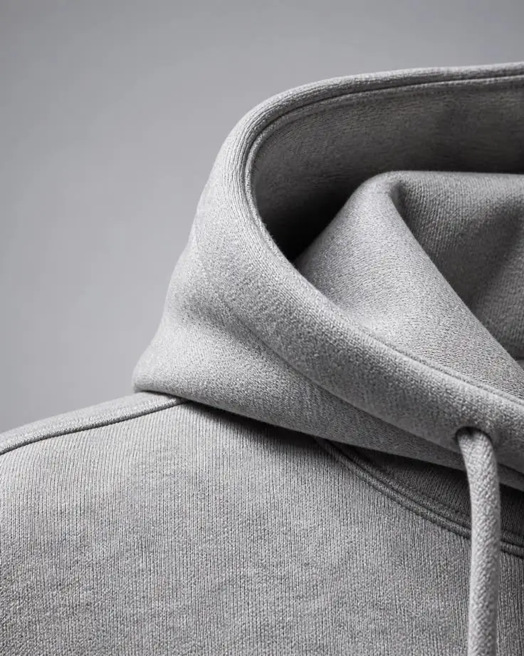 Custom hoodie Hood eyelet drawcord and branded hardware details