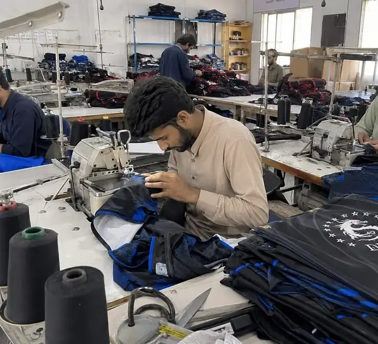 Garment manufacturing stitching and finishing operations on an apparel production line